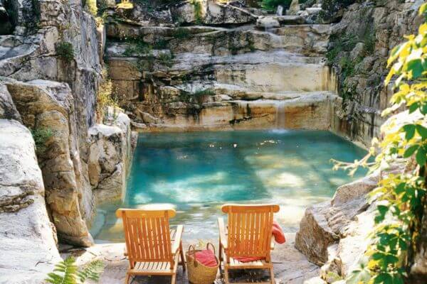 Custom Inground Swimming Pool - The Quarry Pool Looking At Patio and Waterfall