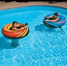 Kids in floats in pool