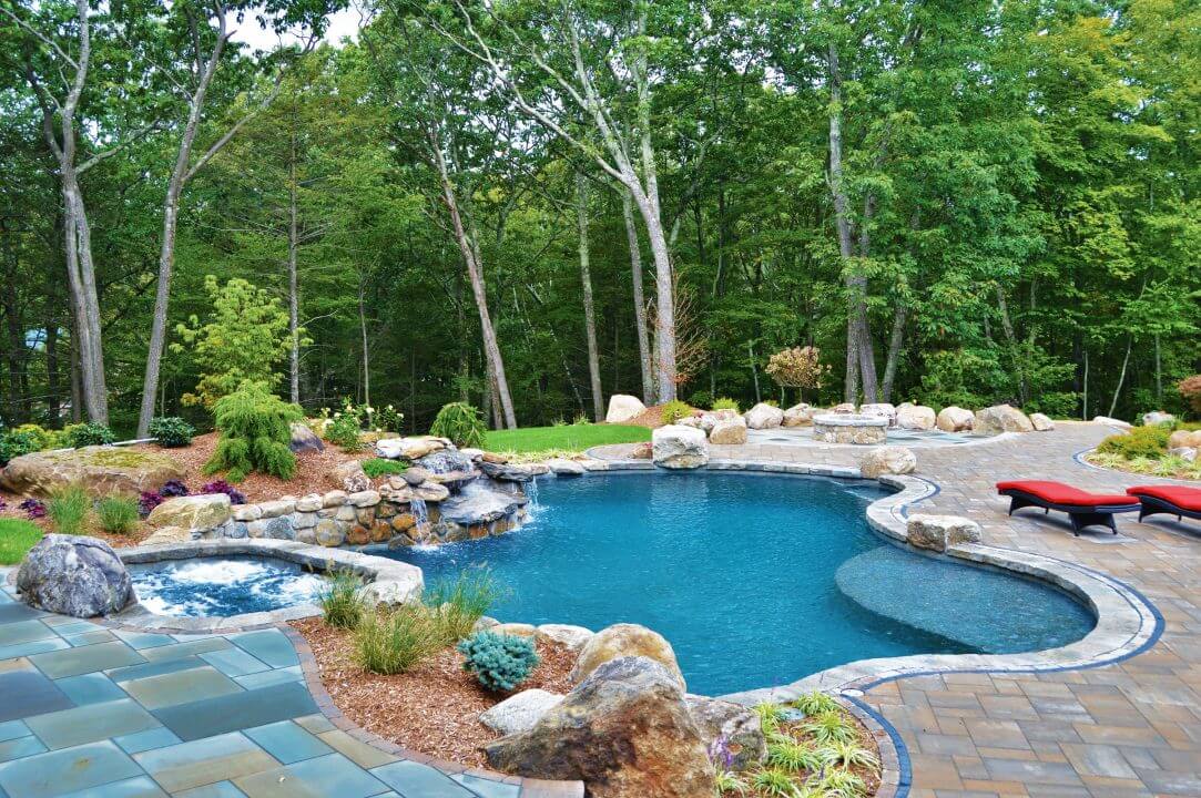 Inground swimming geometric swimming pool with waterfall and spa