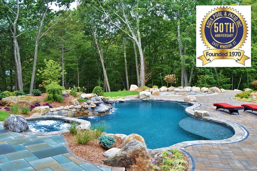 Aqua Pool & Patio gunite swimming pool construction in Connecticut showing pool with 50 years of business badge