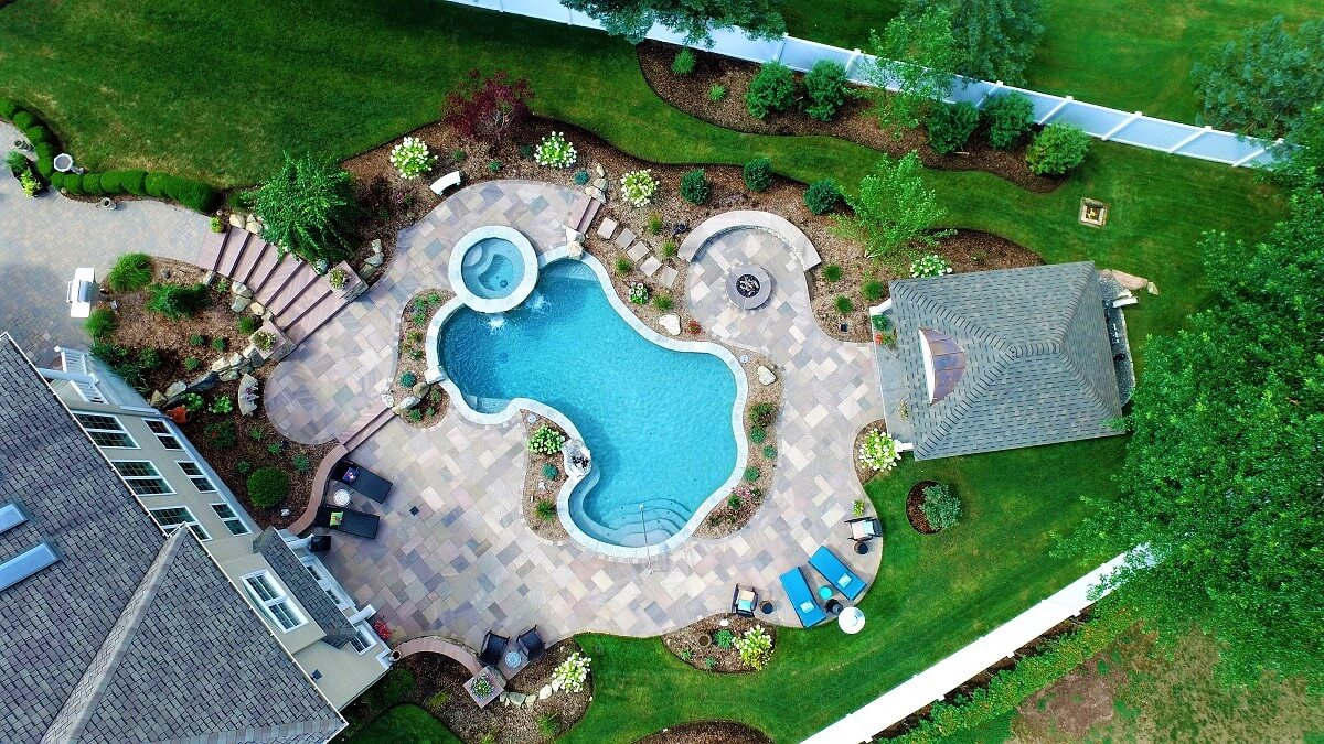 Aqua Pool & Patio gunite swimming pool construction in Connecticut showing pool with covered patio