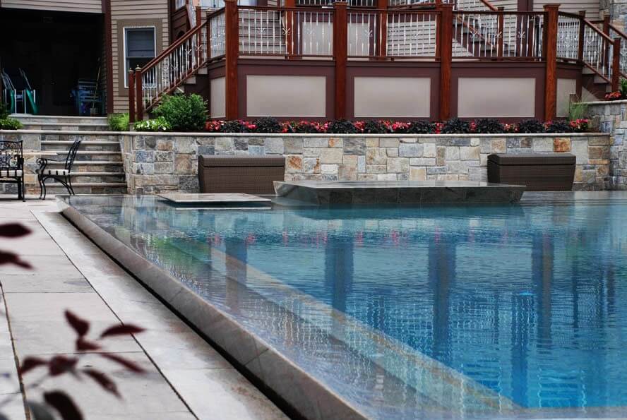 Aqua Pool & Patio gunite swimming pool construction in Connecticut showing zero edge geometric pool
