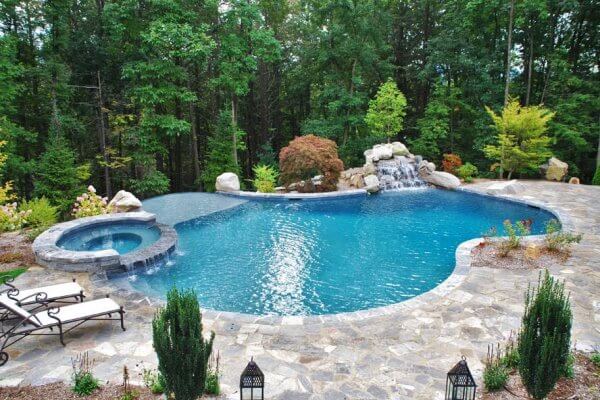 Aqua Pool & Patio gunite swimming pool construction in Connecticut showing freeform pool with pool deck