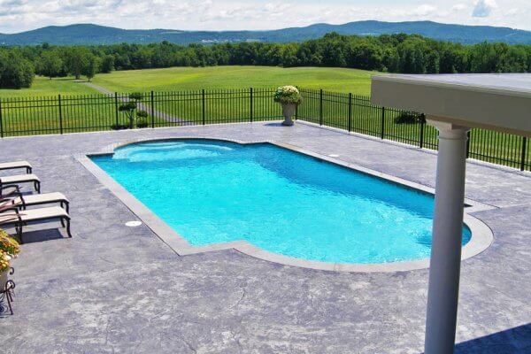 Aqua Pool & Patio gunite swimming pool construction in Connecticut showing pool with seating