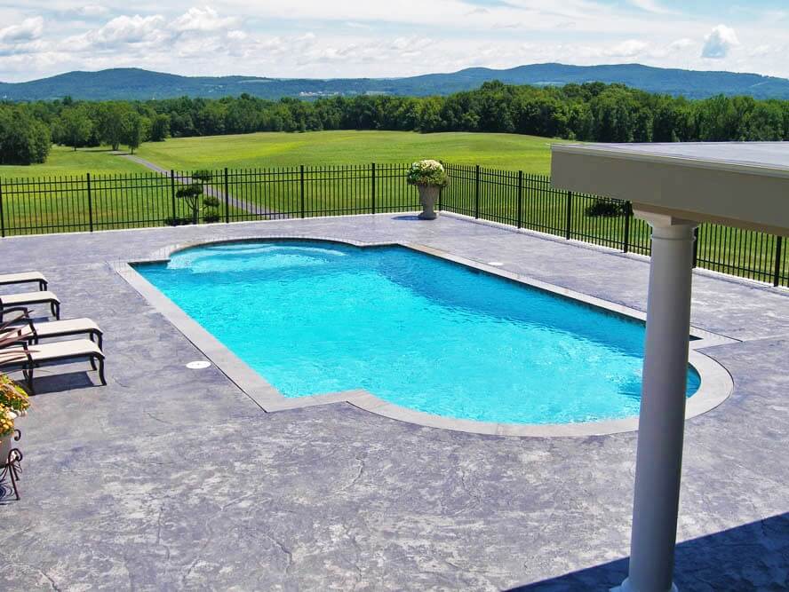 Aqua Pool & Patio gunite swimming pool construction in Connecticut showing pool with seating