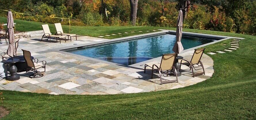 Aqua Pool & Patio gunite swimming pool construction in Connecticut showing swimming pool and patio area