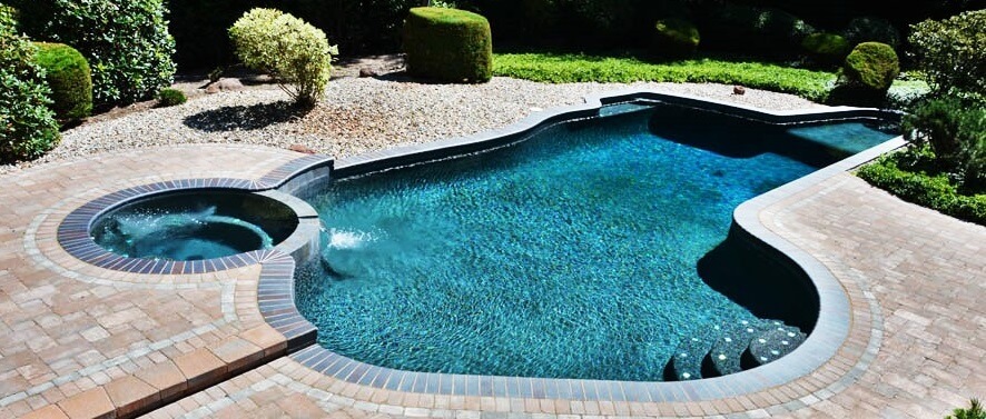 Aqua Pool & Patio gunite swimming pool construction in Connecticut showing renovated pool with spa