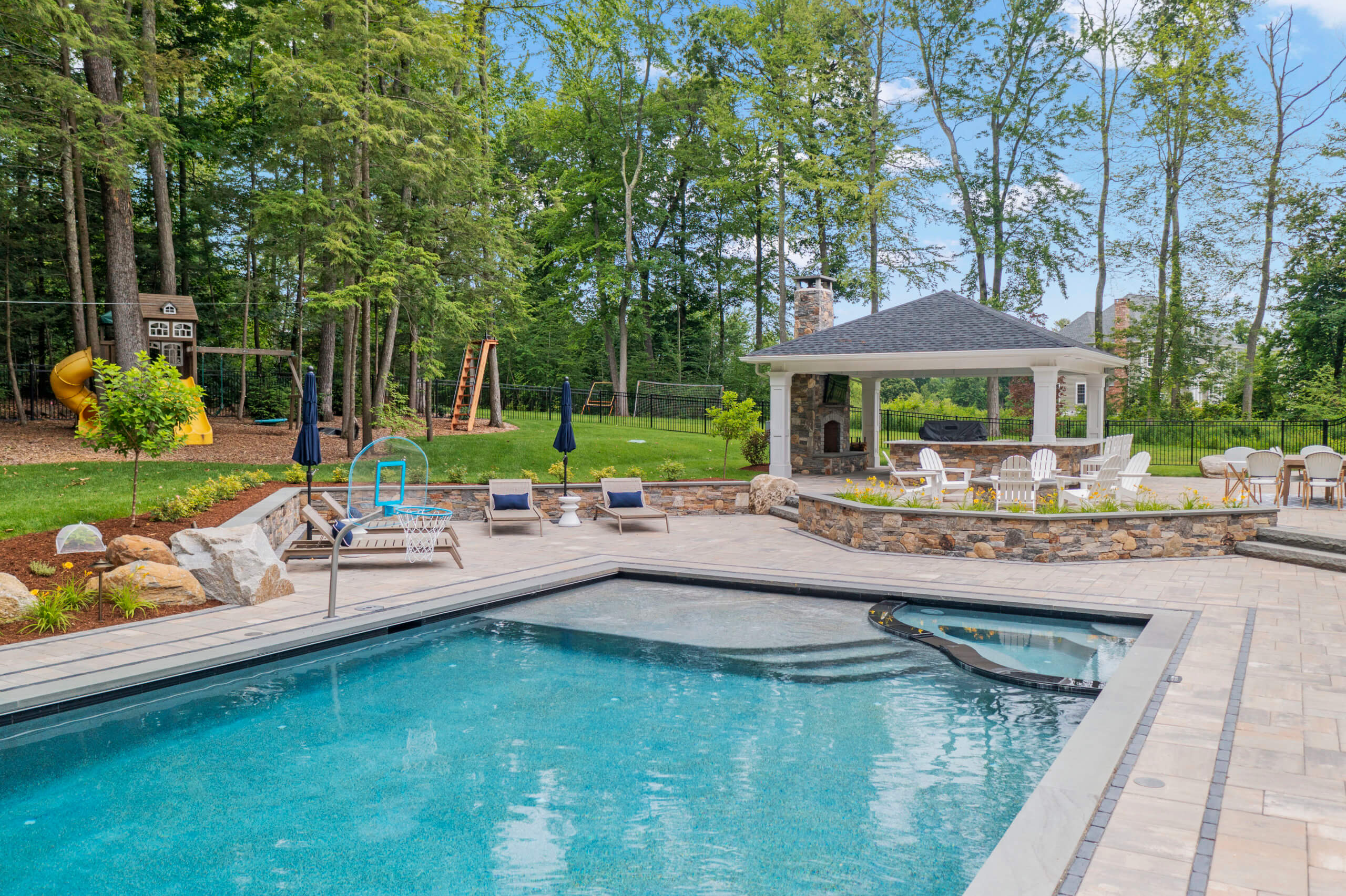 Aqua Pool & Patio gunite swimming pool construction in Connecticut showing rectangular pool with custom patio