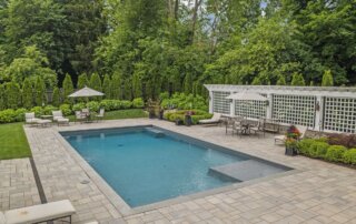 Rectangular swimming pool with landscaping