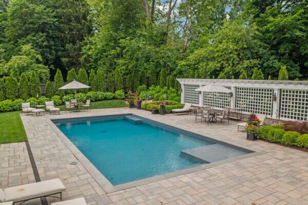 Rectangular swimming pool with landscaping