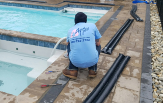 Aqua Pool team member closing a swimming pool