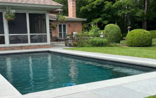 Geometric Pool with house in background