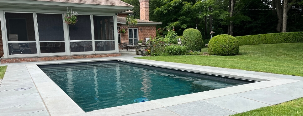 Geometric Pool with house in background